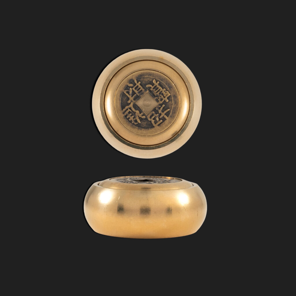 Moneda Feng Shui giratoria
